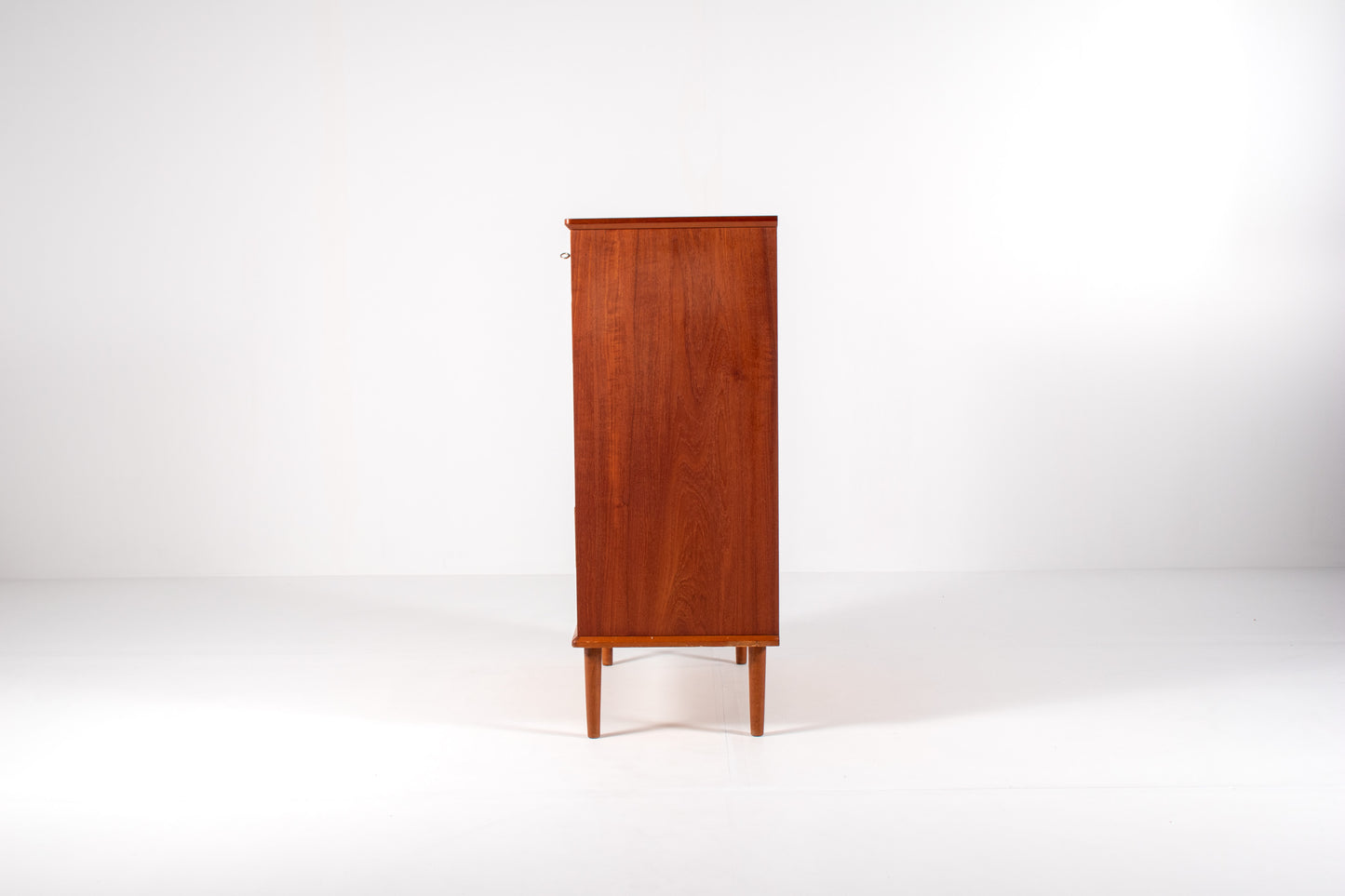 Side view of mid-century modern teak dresser