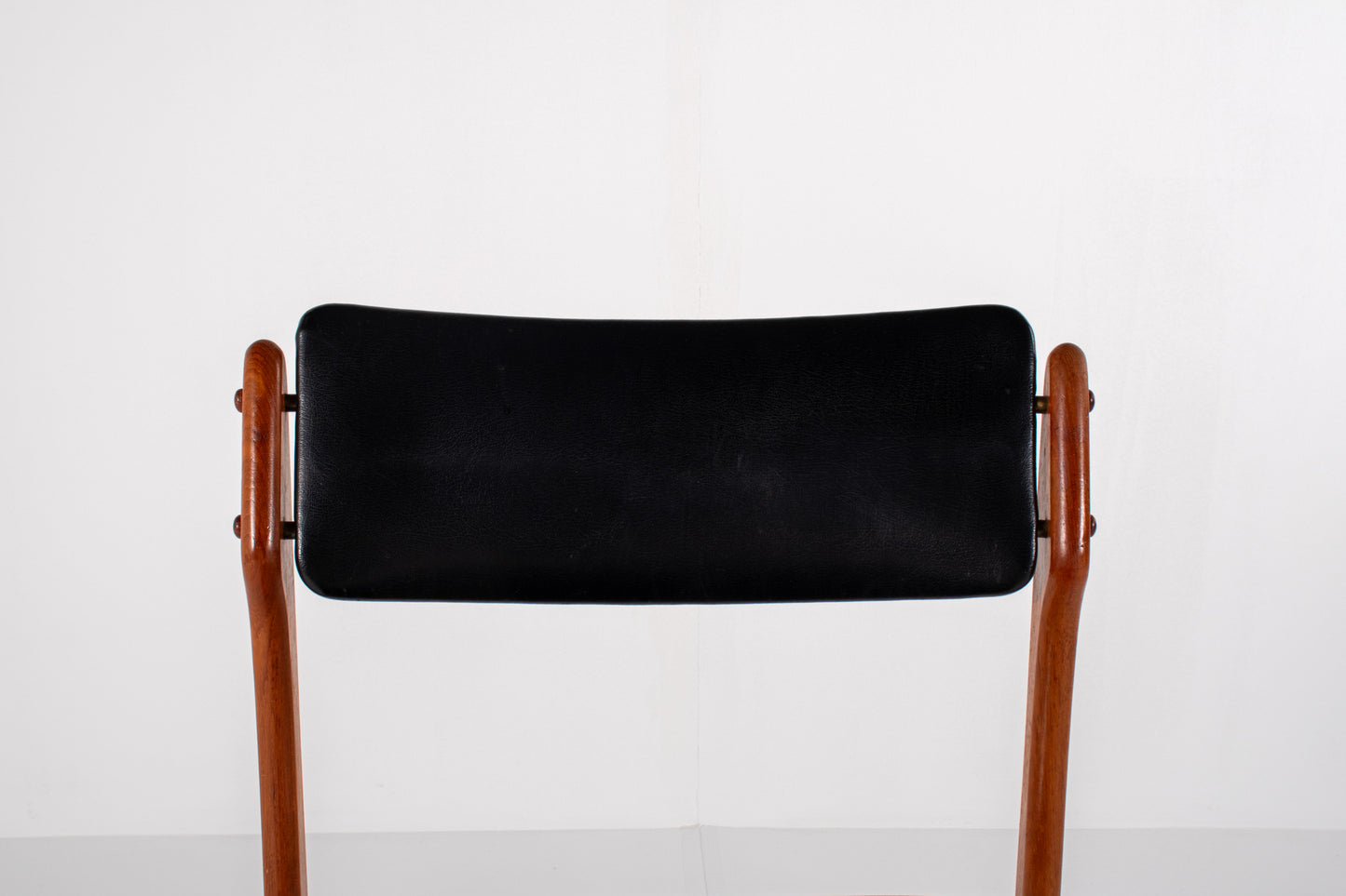 Vintage Danish dining chairs in teak with black skai upholstery