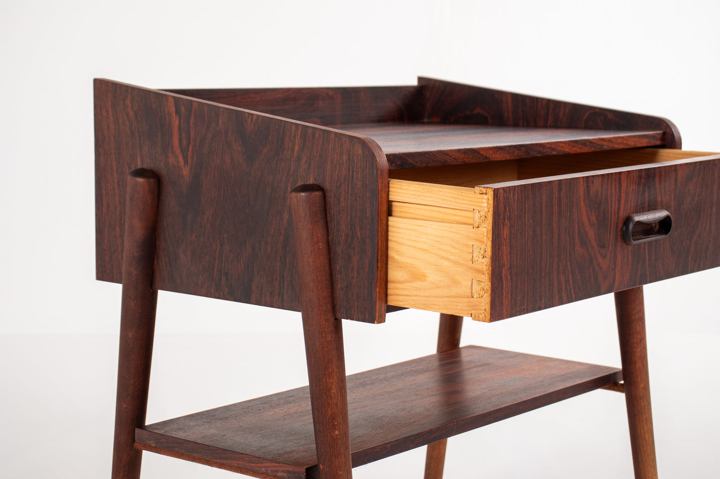 Set of two mid-century rosewood bedside tables with built-in drawer and open compartment