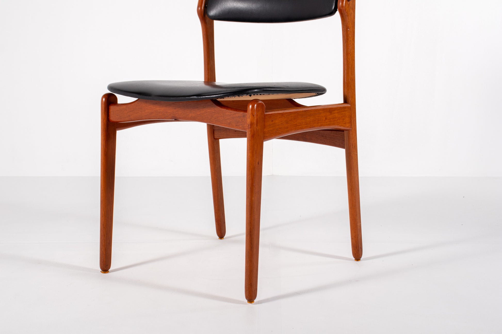 Vintage Danish dining chair in teak with black skai upholstery