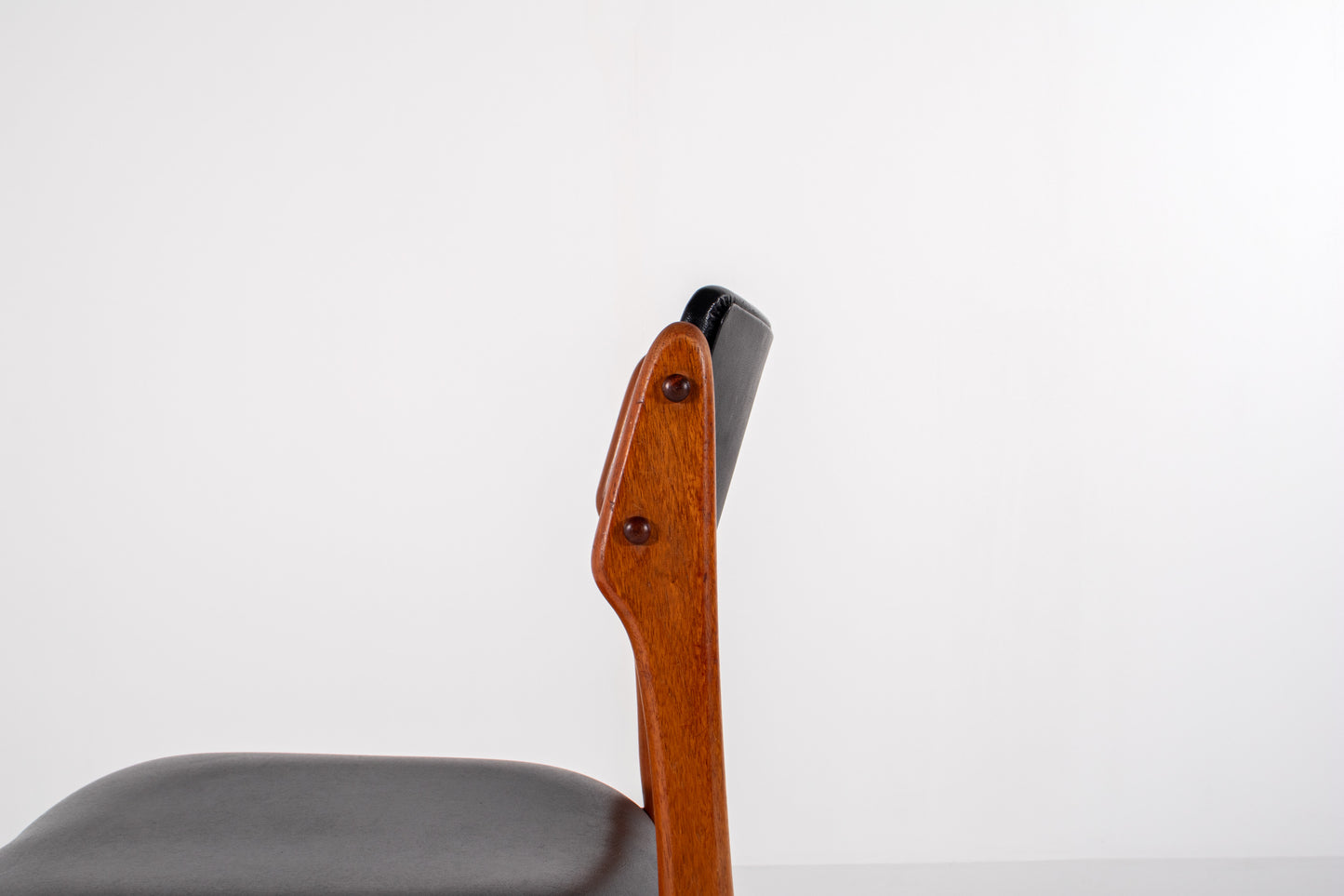 Detail of curved backrest on Scandinavian teak chair