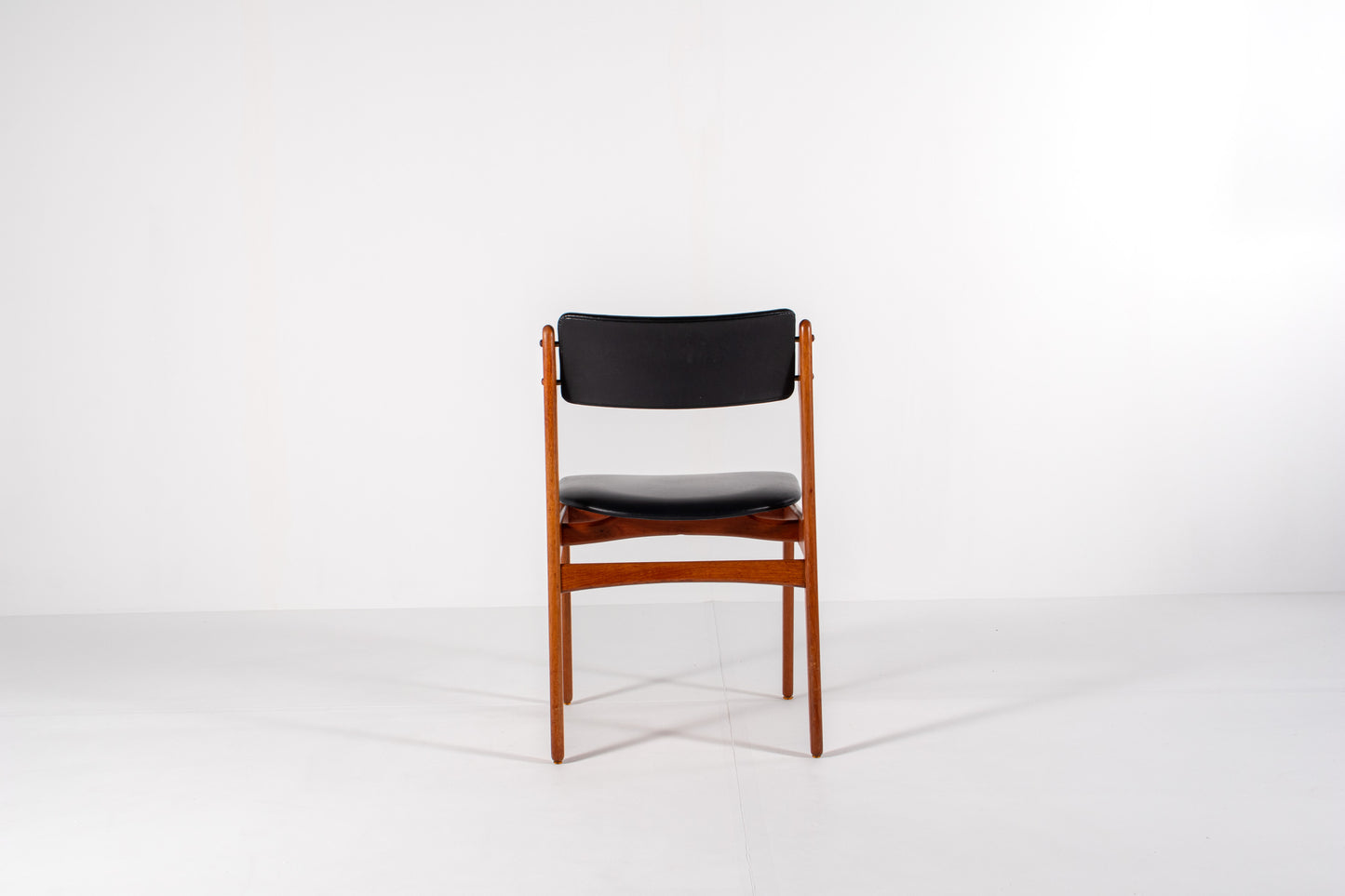 Vintage Danish dining chair in teak with black skai upholstery