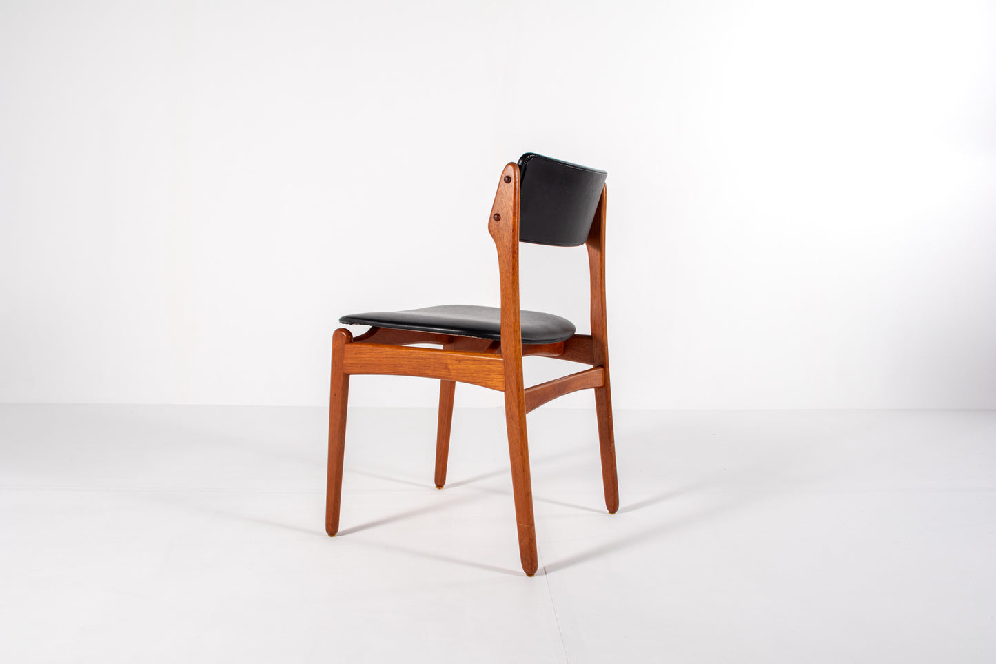 Vintage Danish dining chairs in teak with black skai upholstery