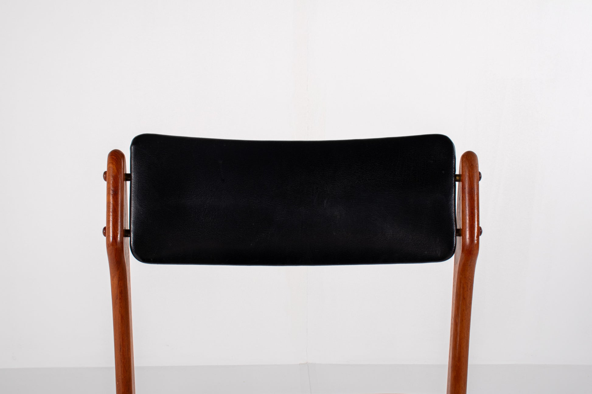 Vintage Danish dining chairs in teak with black skai upholstery