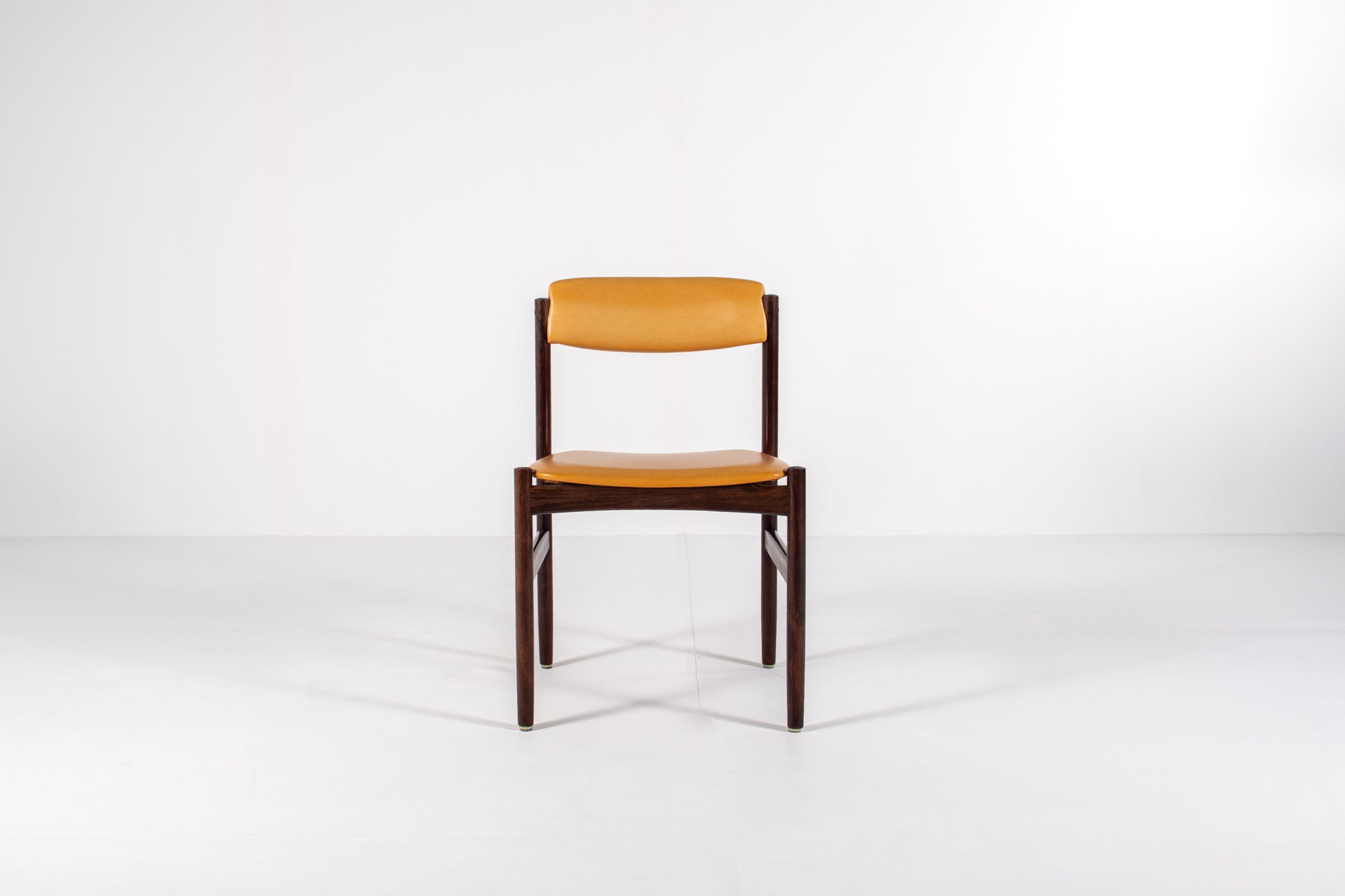 Danish dining chair with rosewood frames and yellow skai upholstery