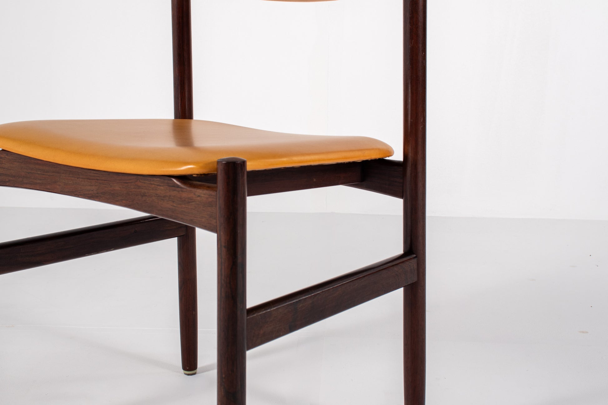 Danish dining chair with rosewood frame and yellow skai upholstery
