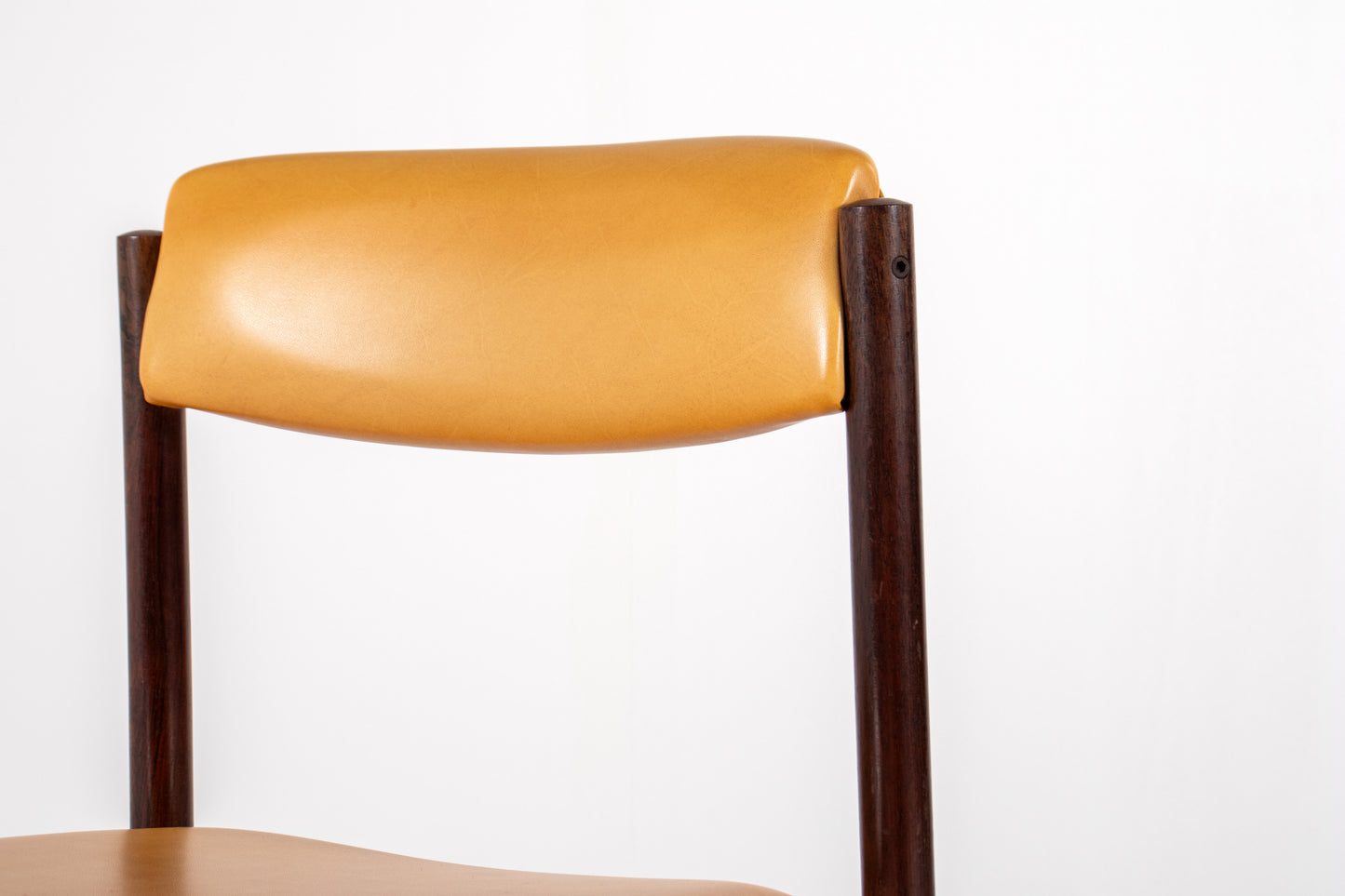 Danish dining chair with rosewood frame and yellow skai upholstery
