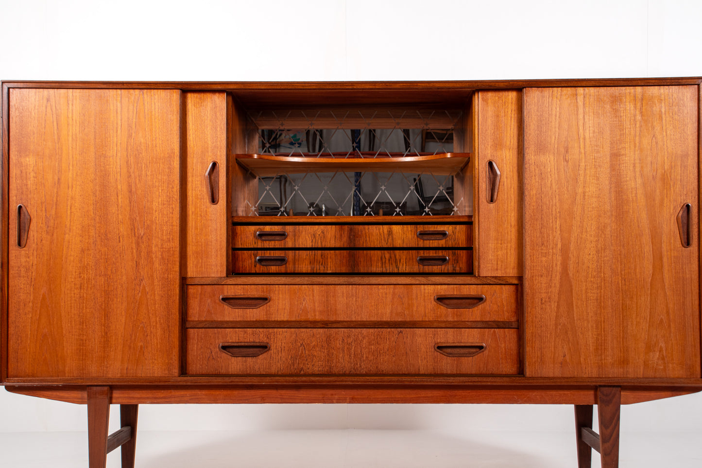 Interior view of Danish sideboard with sliding doors and shelving