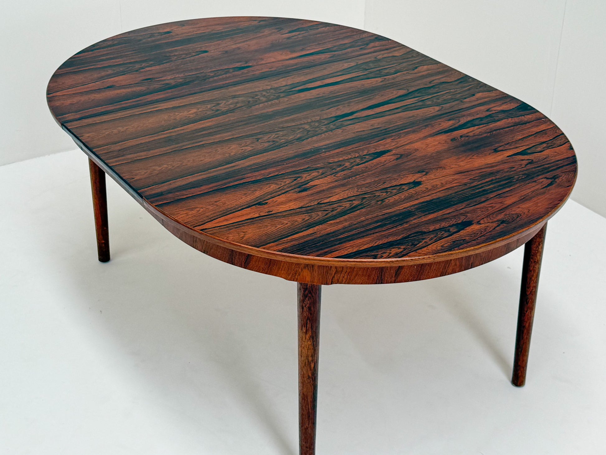 Scandinavian modern extendable rosewood dining table and chairs