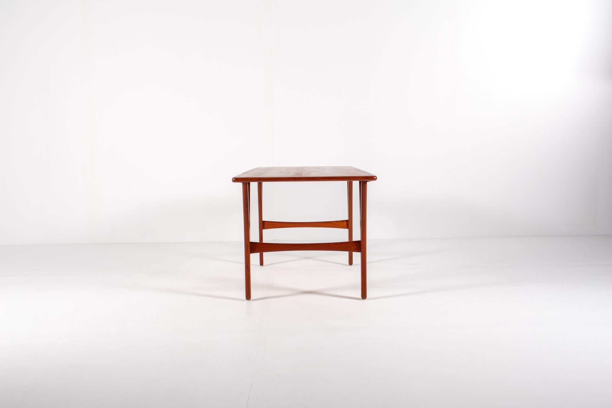 Side view of large mid-century modern teak coffee table