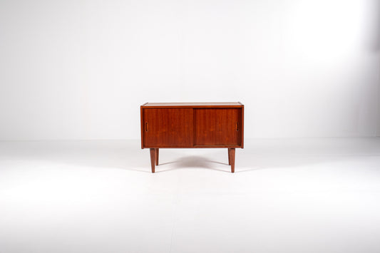 Compact vintage teak cabinet with recessed handles and tapered legs
