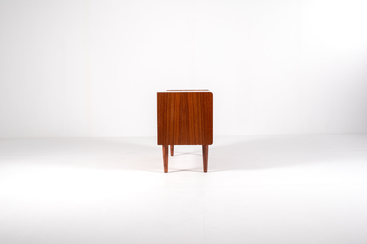 Mid-century modern teak cabinet with sliding doors