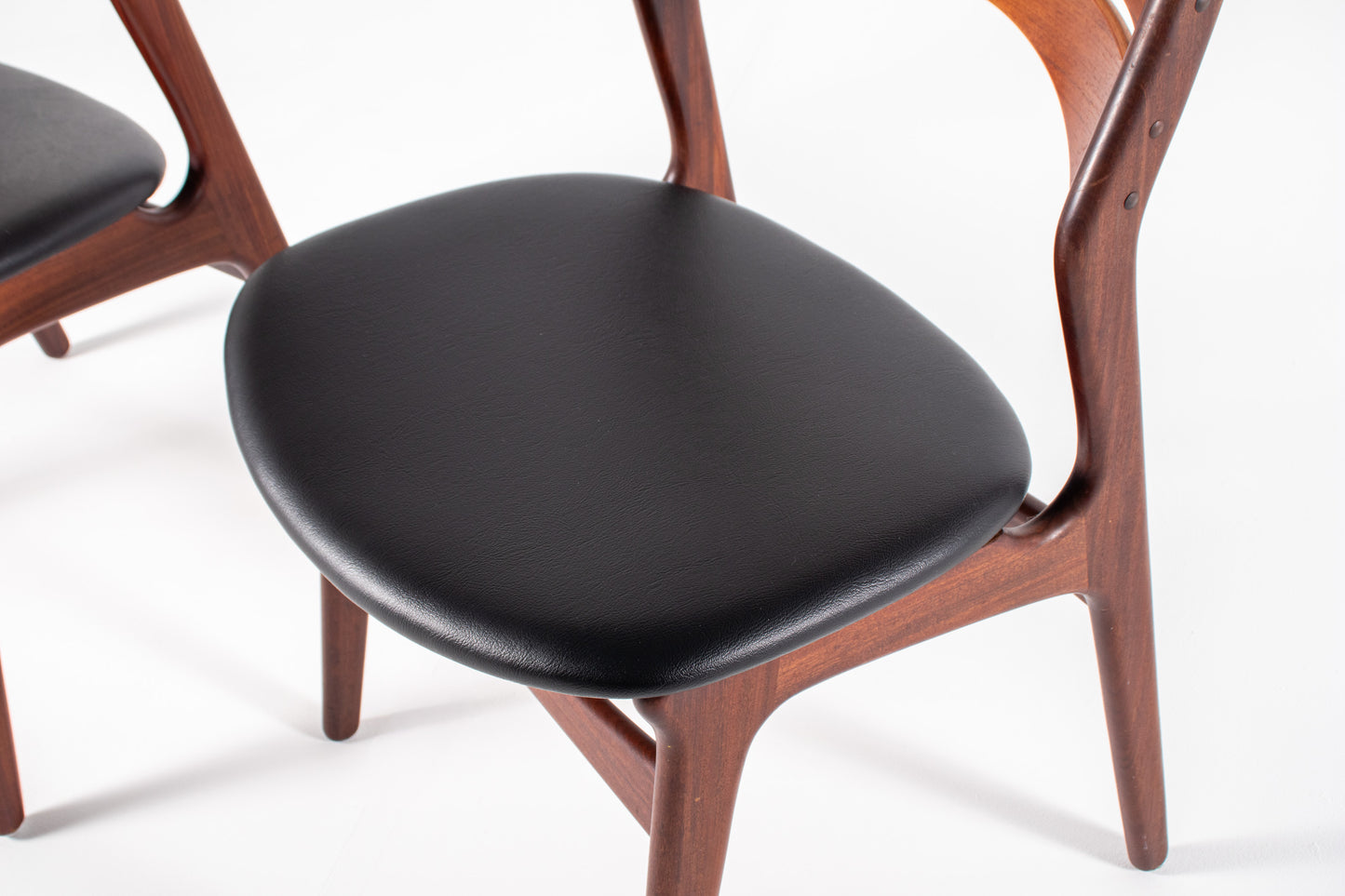 Danish teak chairs black skai upholstery