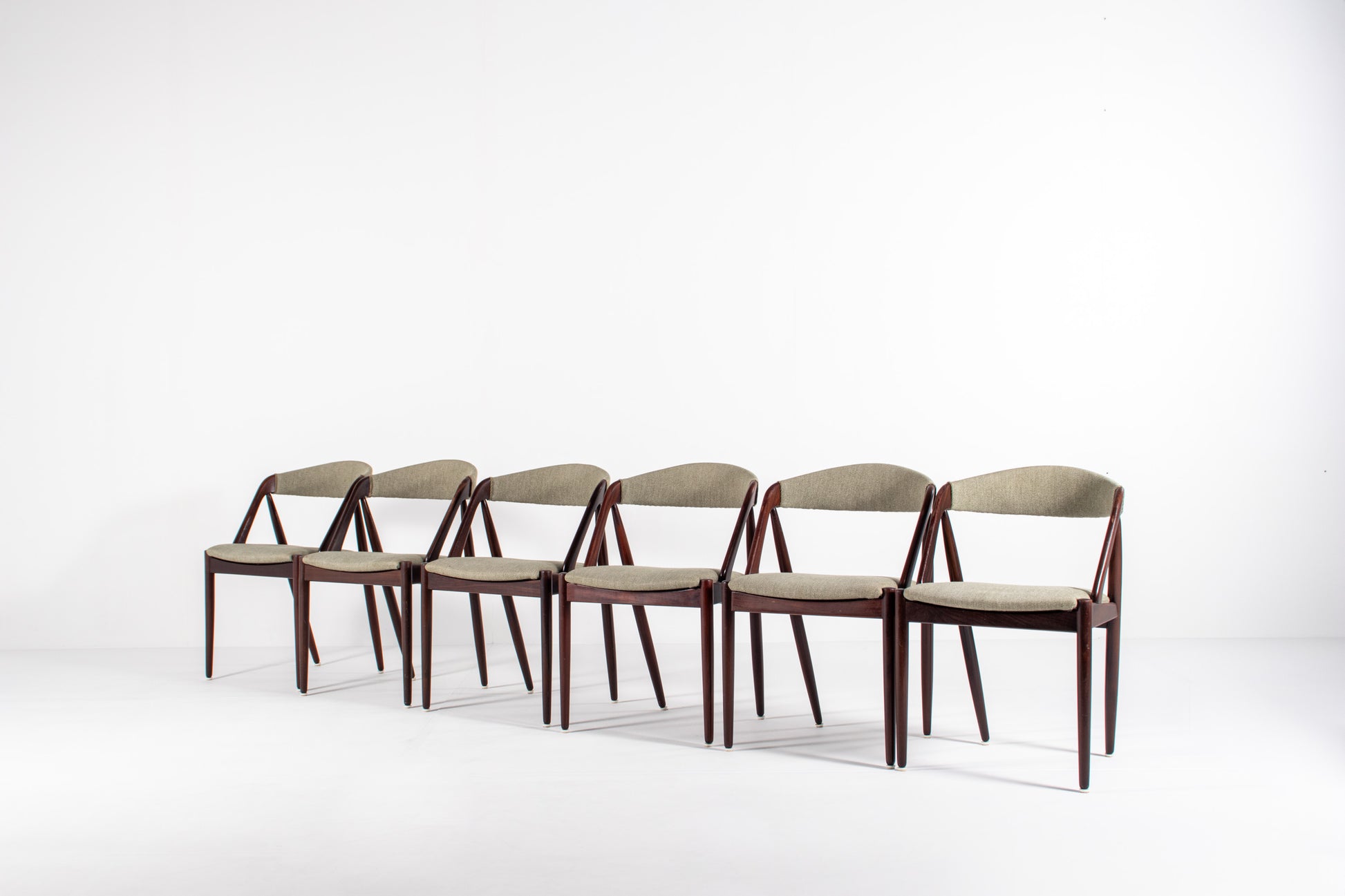 Set of six Kai Kristiansen Model 31 Danish mid-century dining chairs in teak with upholstered seats