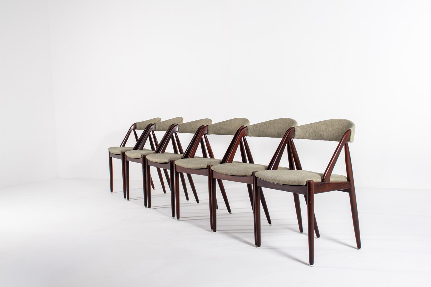 Set of six Kai Kristiansen Model 31 Danish mid-century dining chairs in teak with upholstered seats