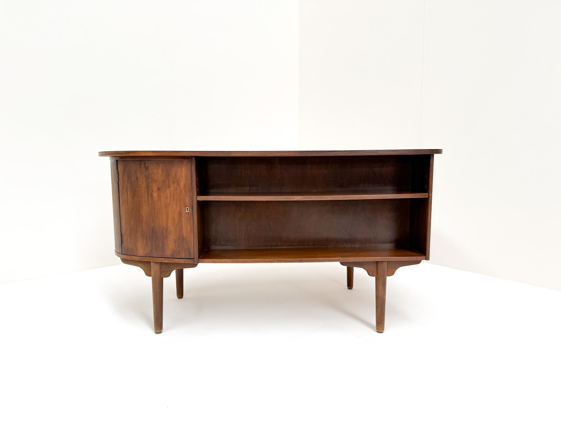 Sculptural curved walnut desk mid-century design bookshelf back