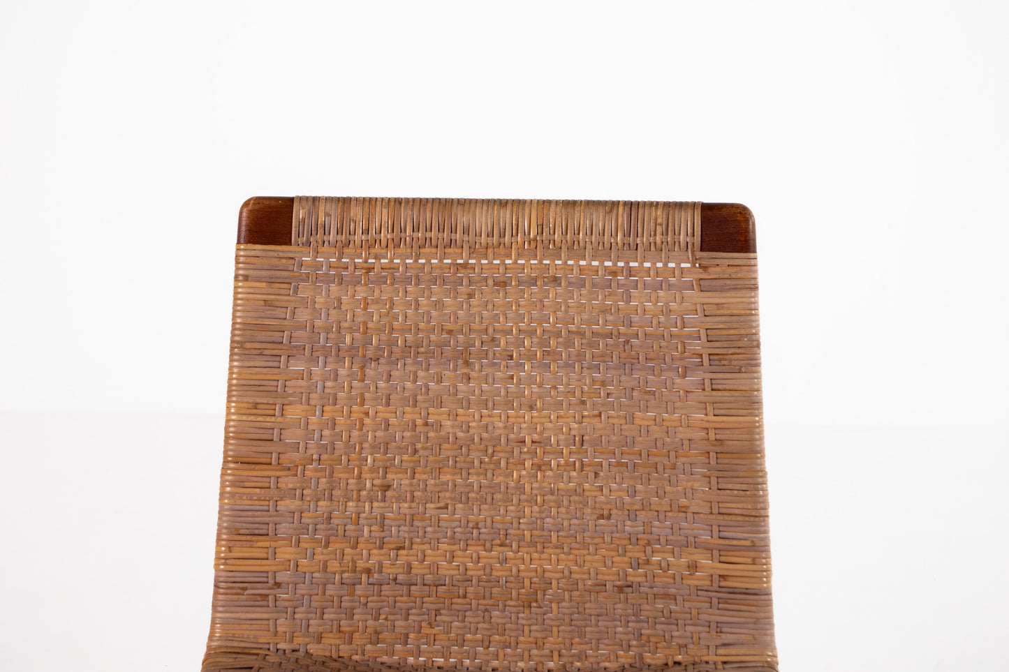Scandinavian teak chair with woven rattan backrest