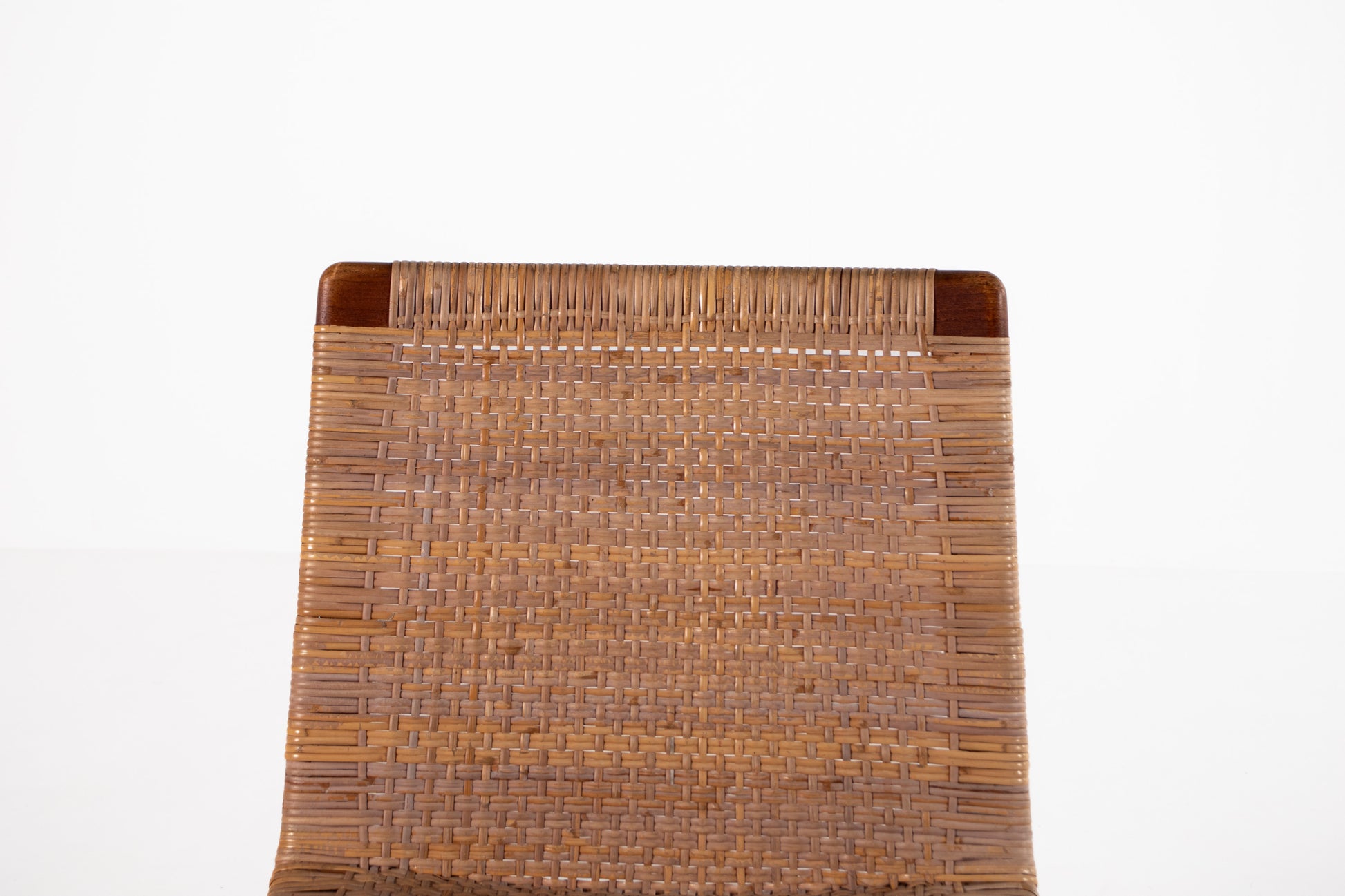 Scandinavian teak chair with woven rattan backrest