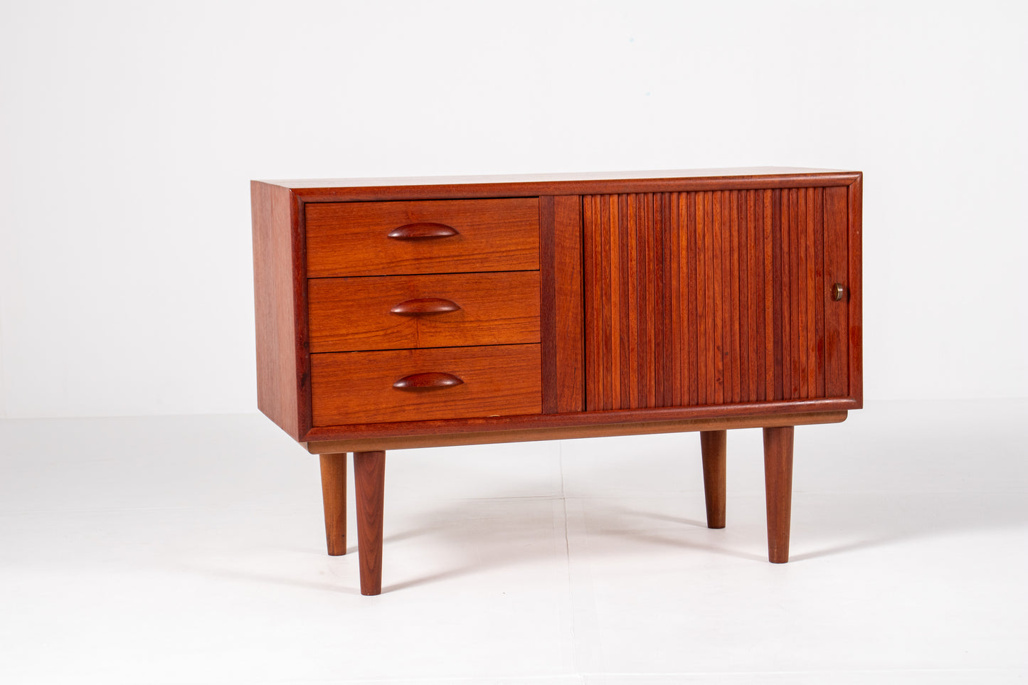 Vintage Danish teak cabinet with tambour door