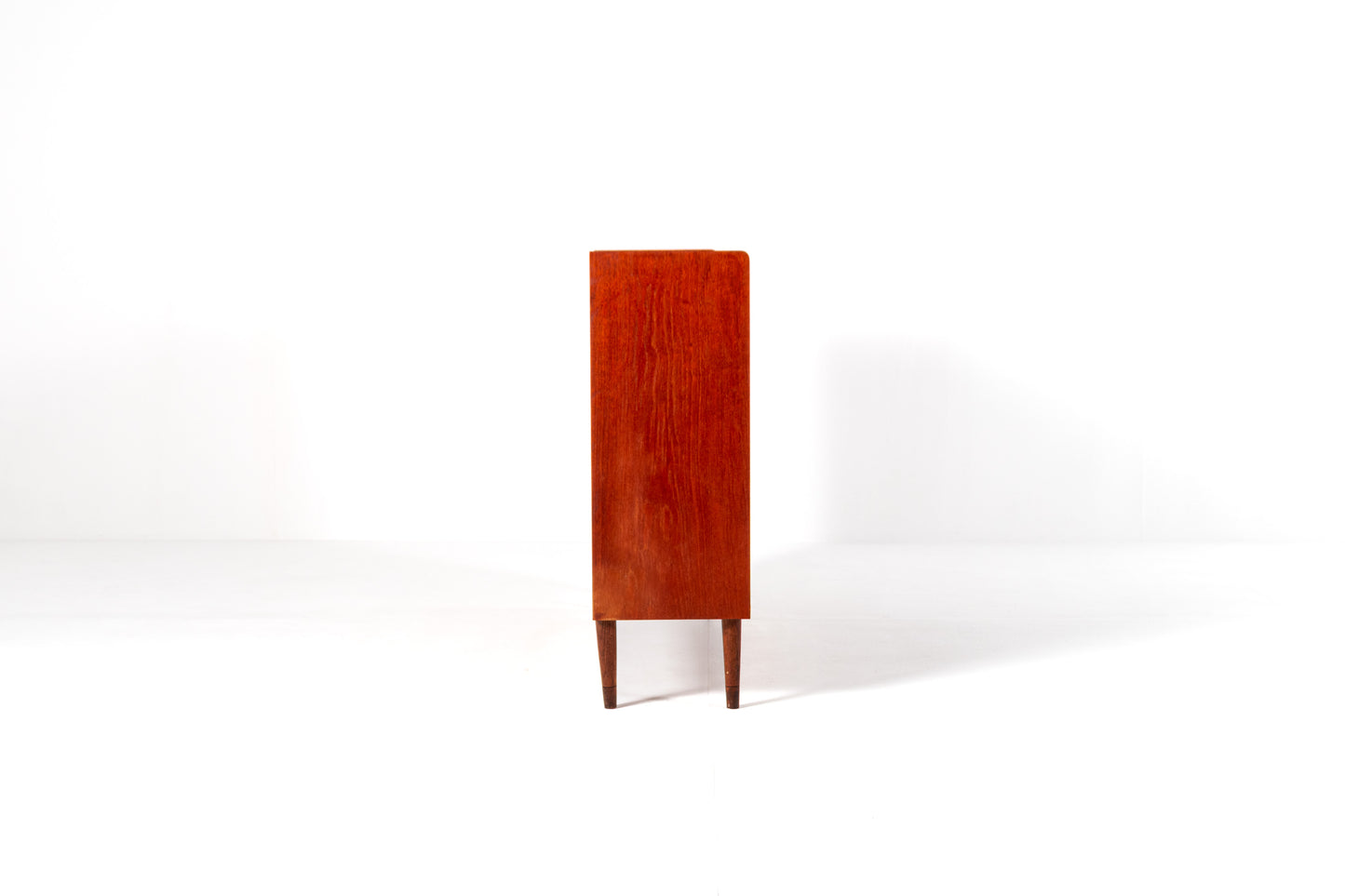 Mid century teak cabinet open shelves drawers side view