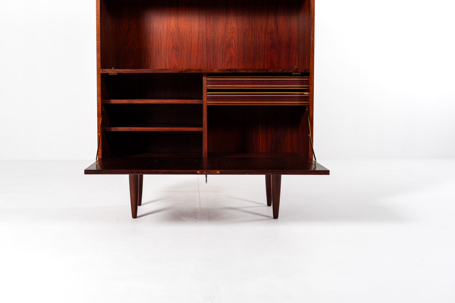 Drop down cabinet interior compartments