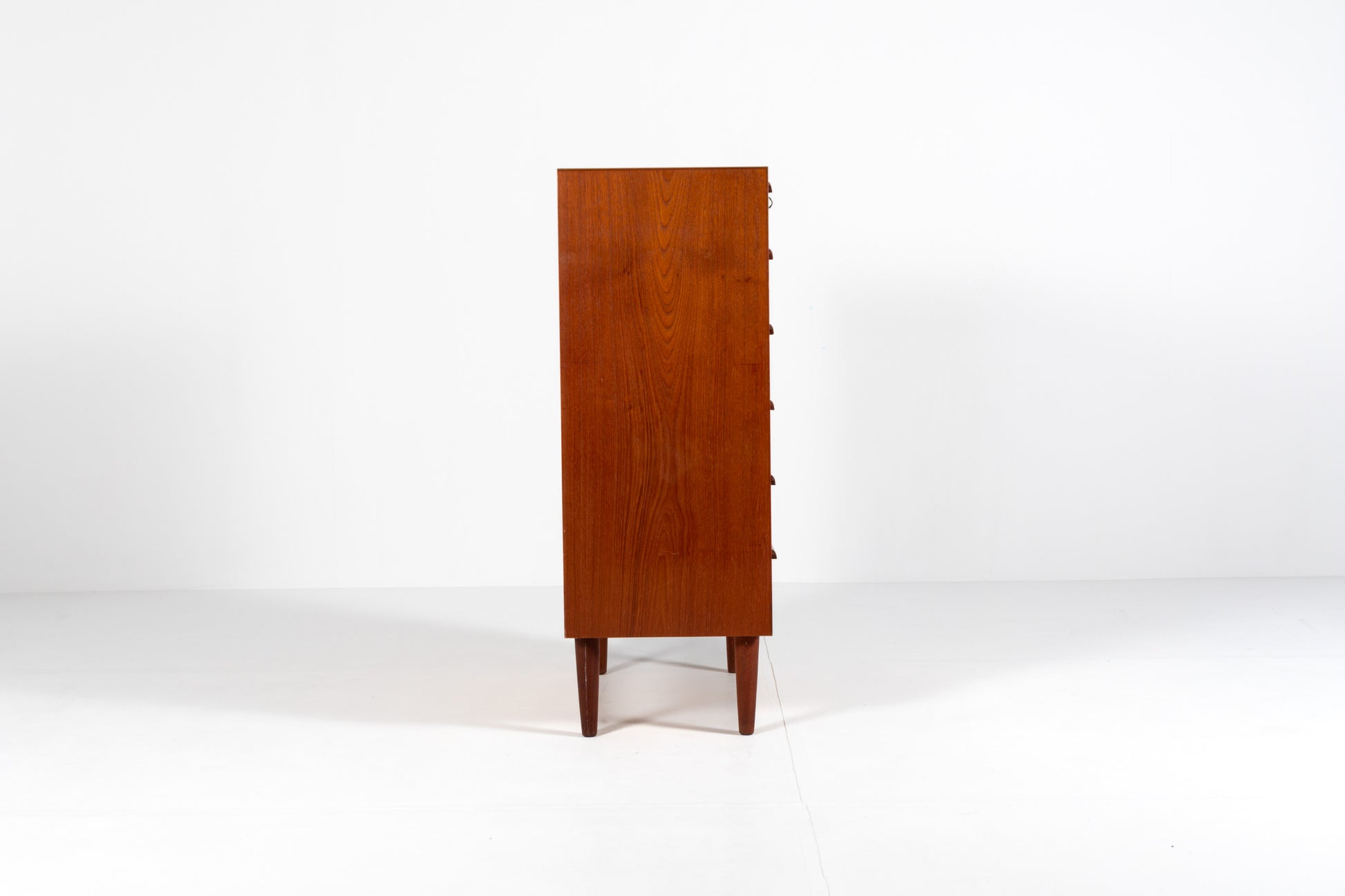 Danish Mid-Century teak tallboy chest of drawers, side view