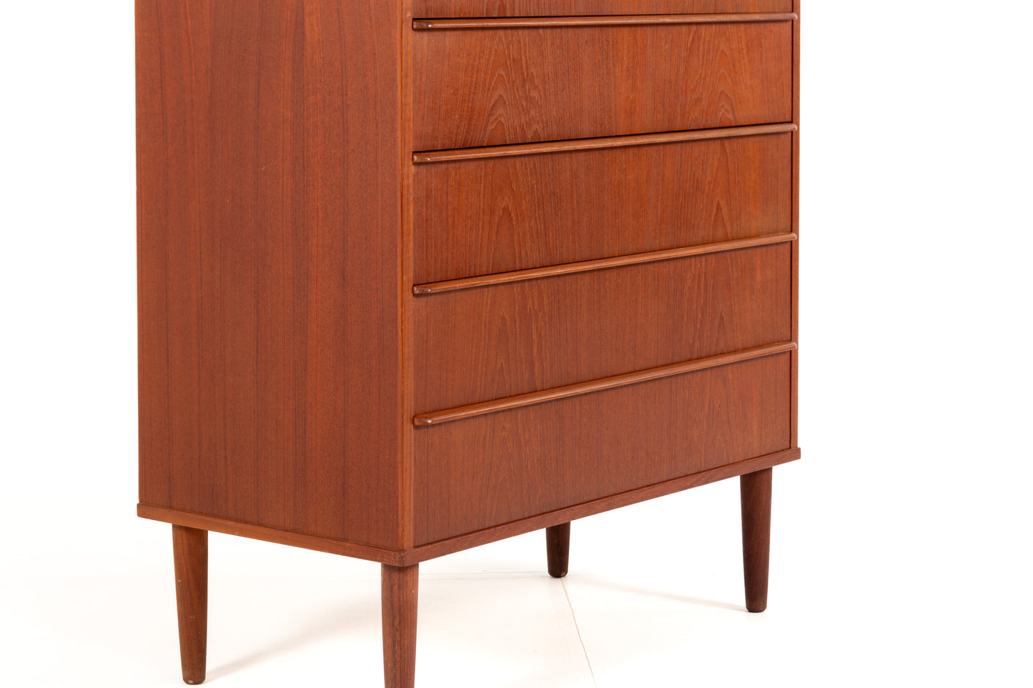 Danish teak tallboy with recessed drawer handles.