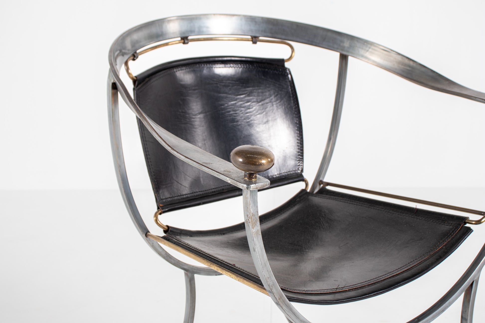 A mid-century modern metal Armchair Alberto Orlandi Pompei  in Steel, Bronze and Black Leather