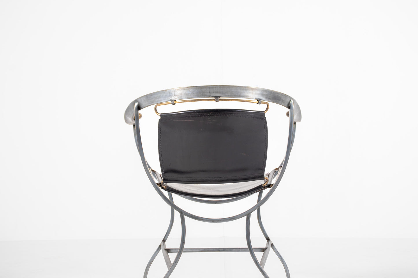 A mid-century modern metal chair Alberto Orlandi Pompei  in Steel, Bronze and Black Leather 
