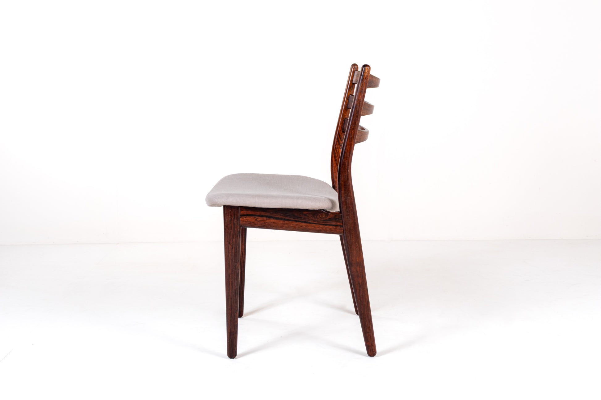 Mid-century rosewood ladder-back dining chairs