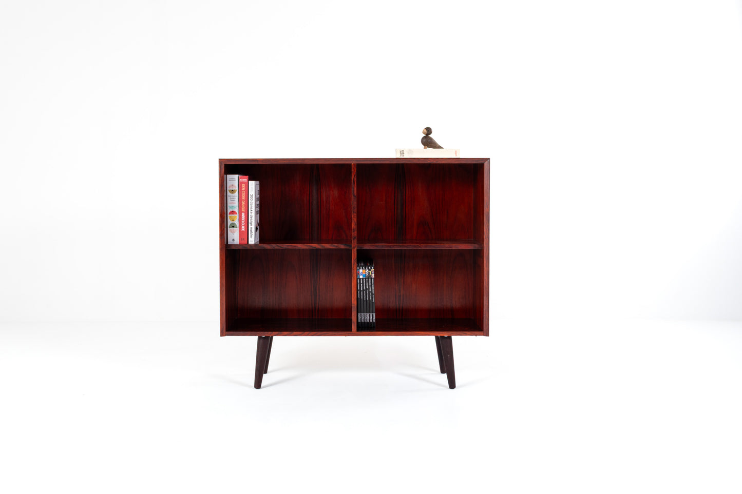 Danish mid-century rosewood bookcase with four open compartments and tapered legs, 1960s Scandinavian cabinet.