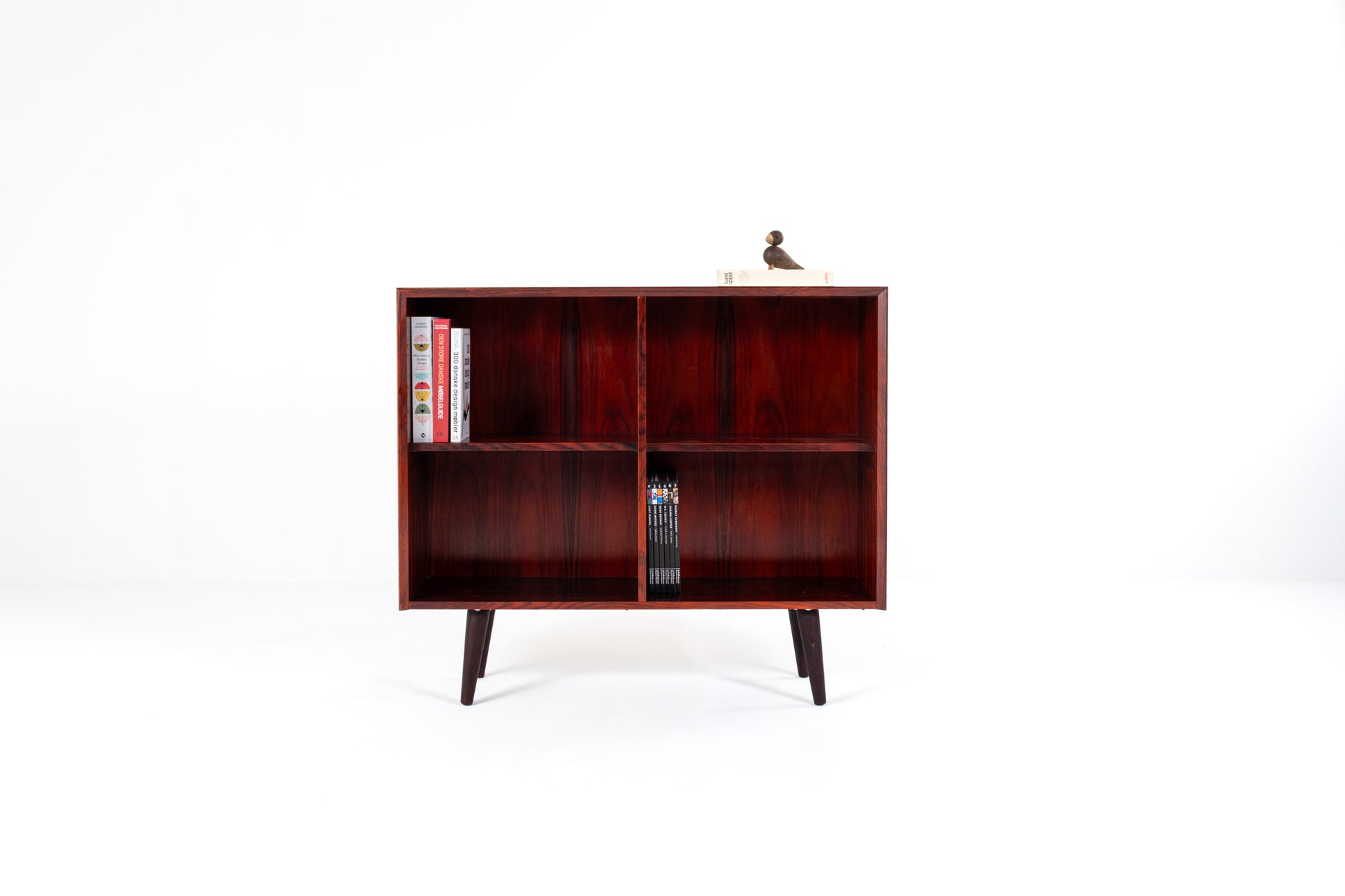 Danish mid-century rosewood bookcase with four open compartments and tapered legs, 1960s Scandinavian cabinet.