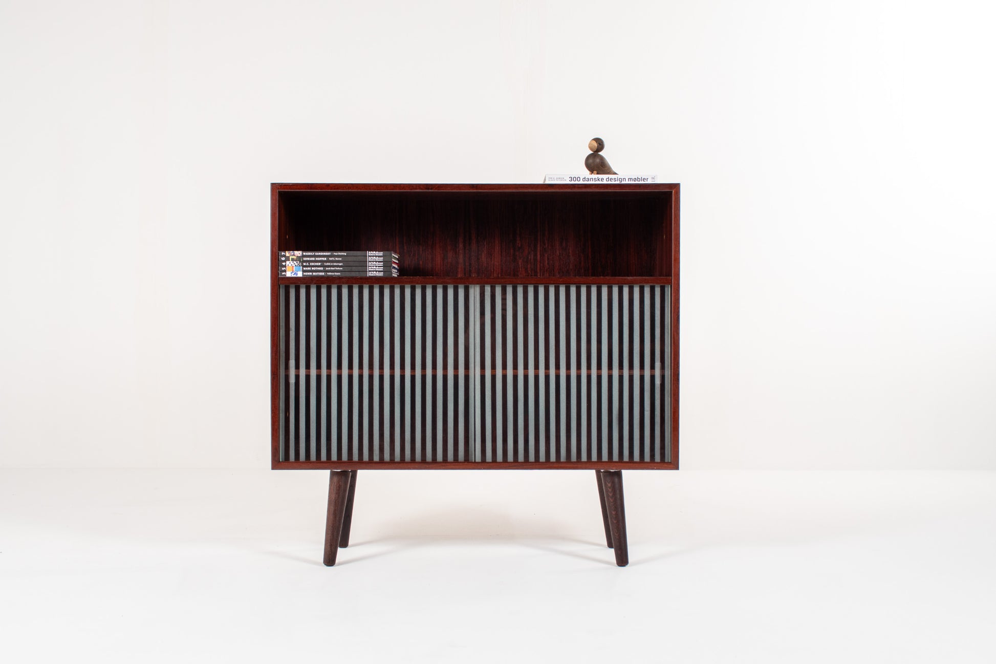 Danish rosewood cabinet with striped glass sliding doors