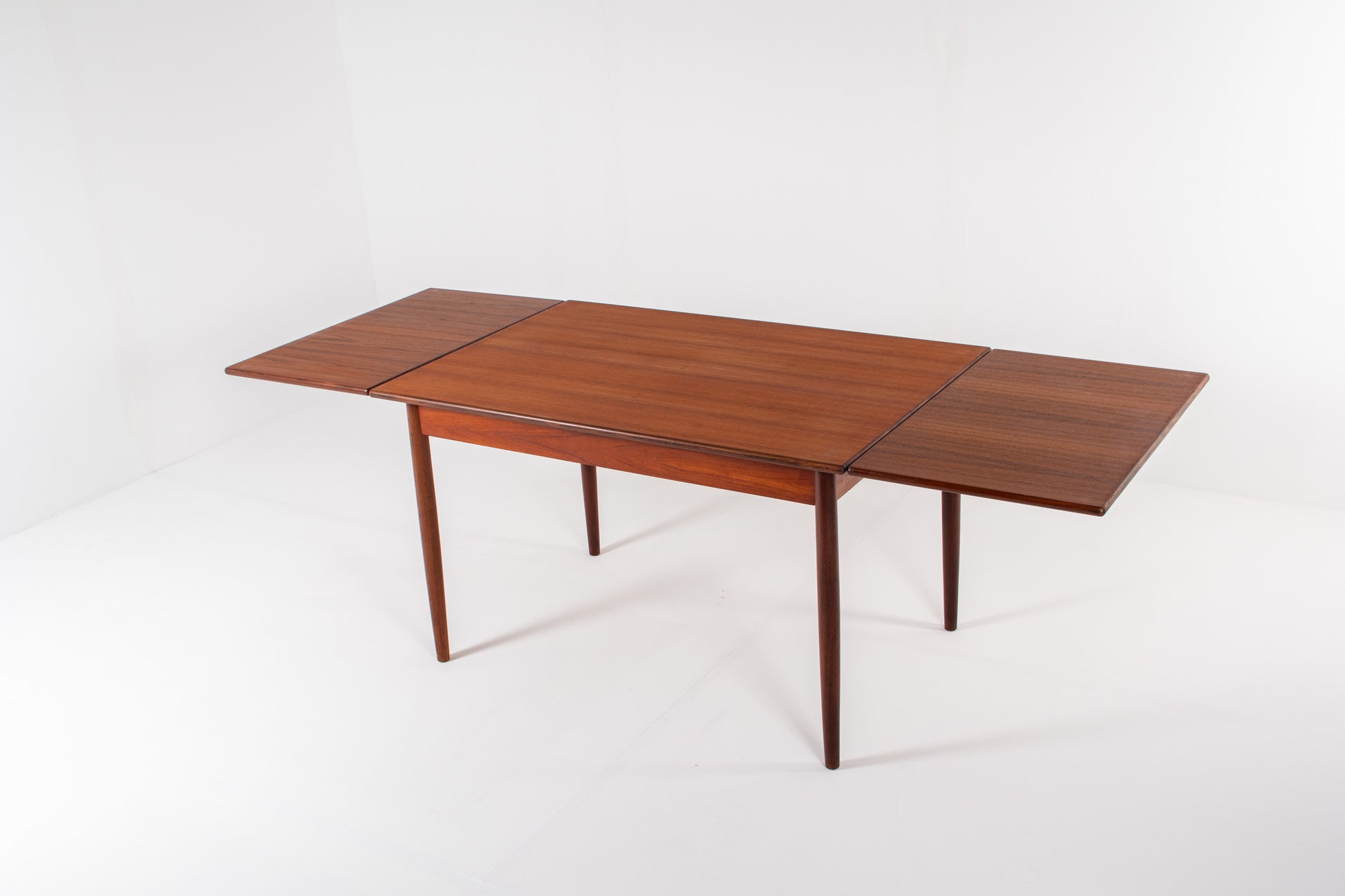 1960s teak dining table extended with two leaves