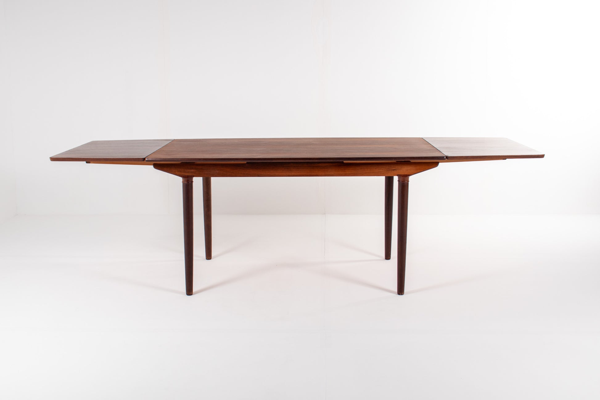 Vintage Danish rosewood extendable table with double leaves