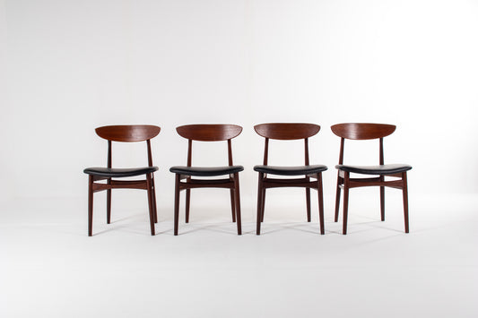 Set of four Danish mid-century modern teak dining chairs with black skai seats