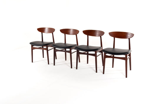 Danish modern dining chairs from the 1960s with curved teak backrests and black upholstery