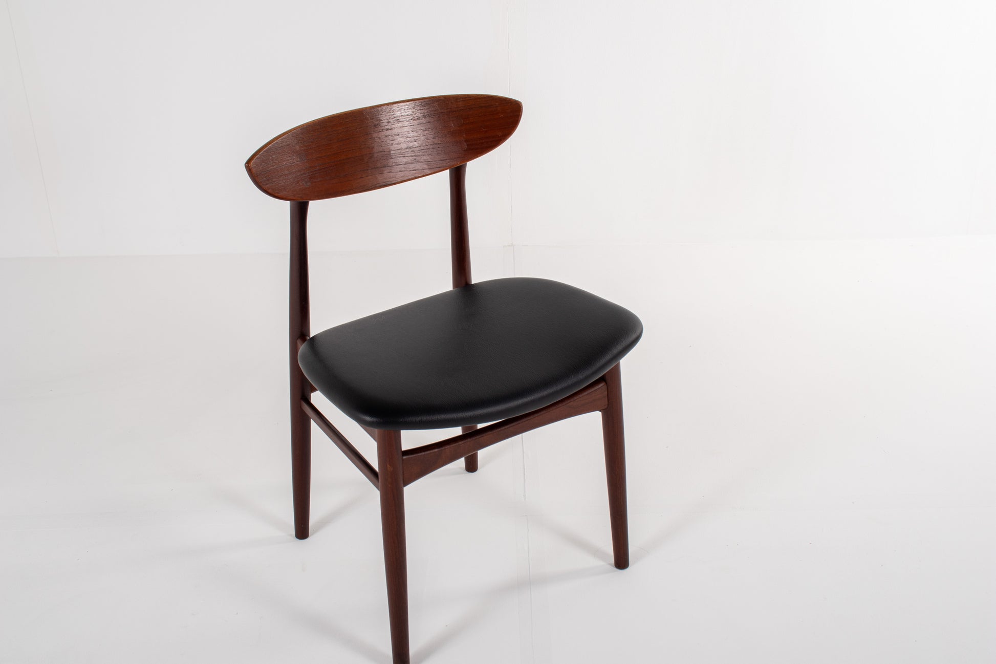 Vintage Danish teak dining chairs with newly upholstered black skai seats