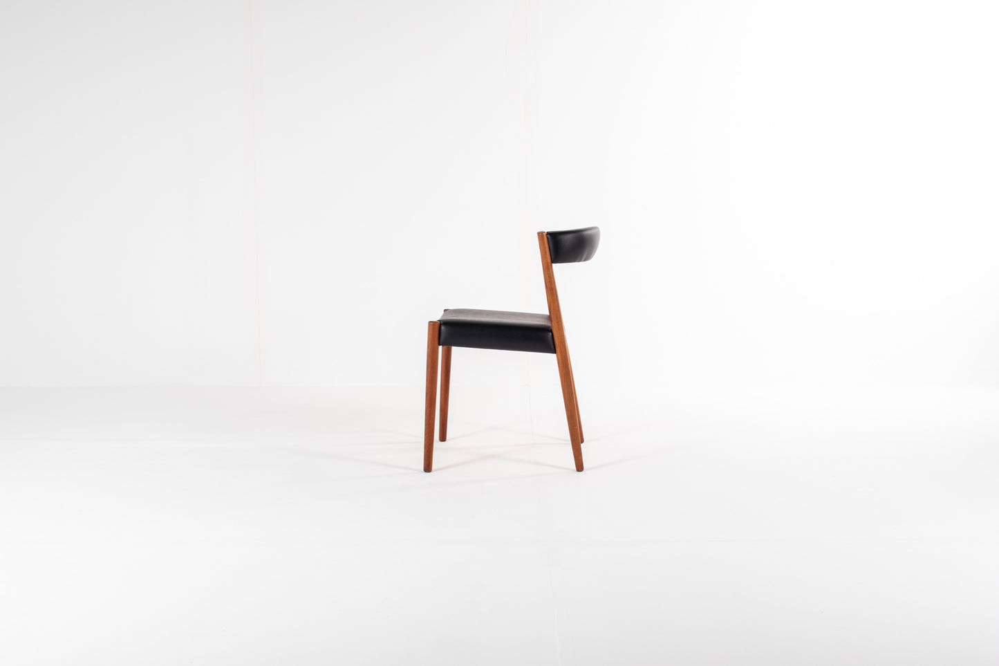 Vintage Danish teak dining chairs with curved backrests