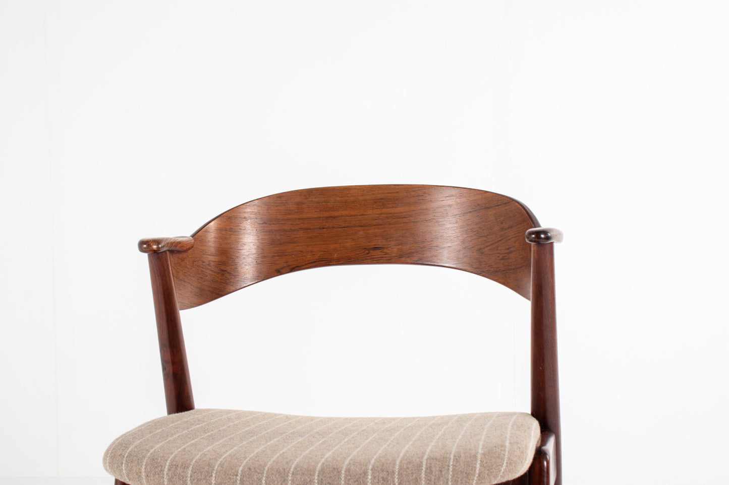 Curved rosewood backrest detail of Danish mid-century dining chair