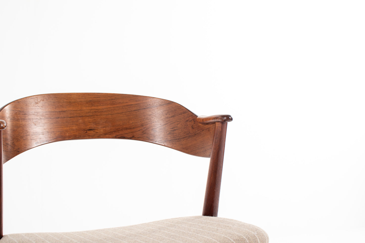 Curved rosewood backrest detail of Danish mid-century dining chair