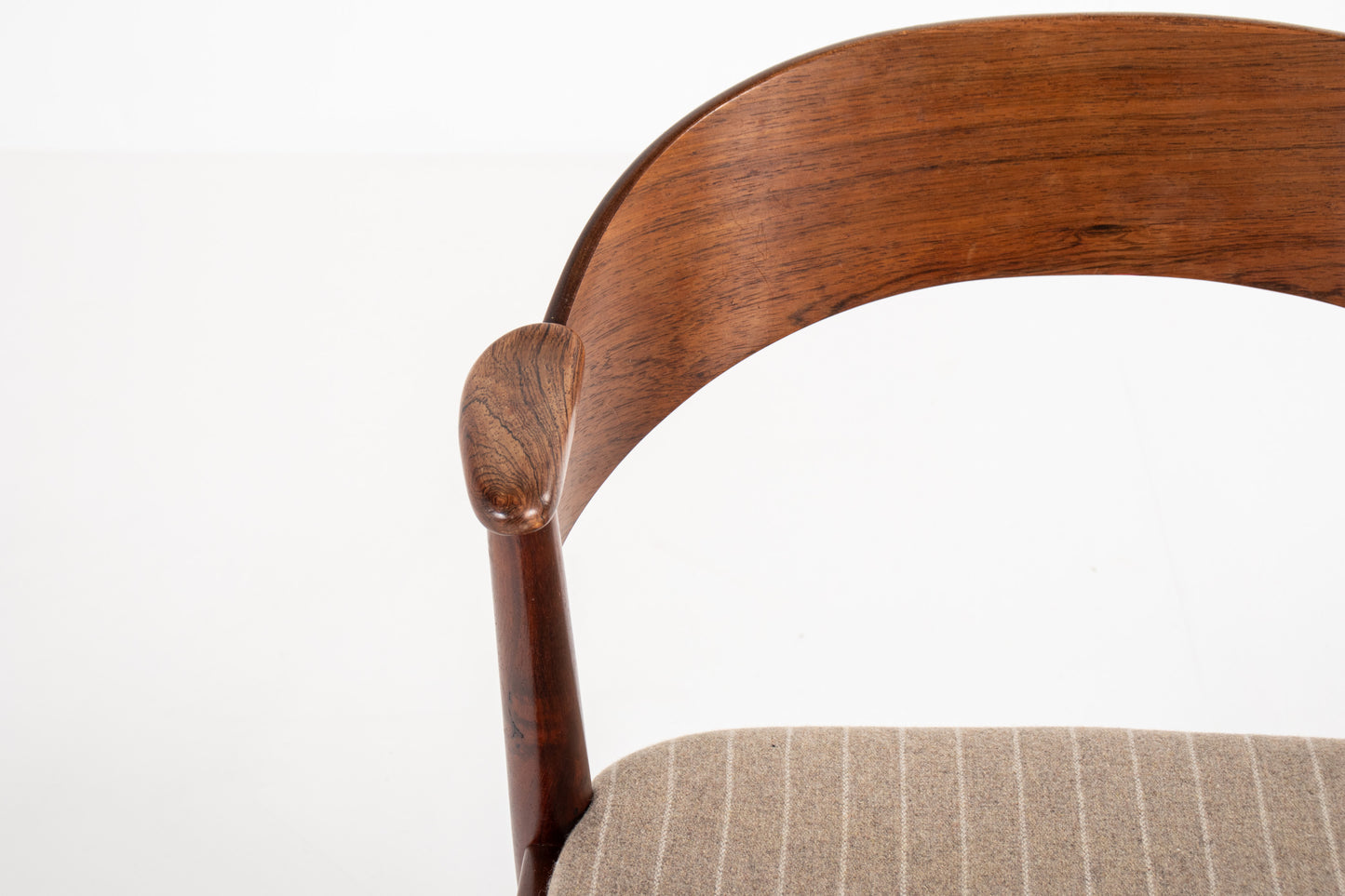 Curved rosewood backrest detail of Danish mid-century dining chair