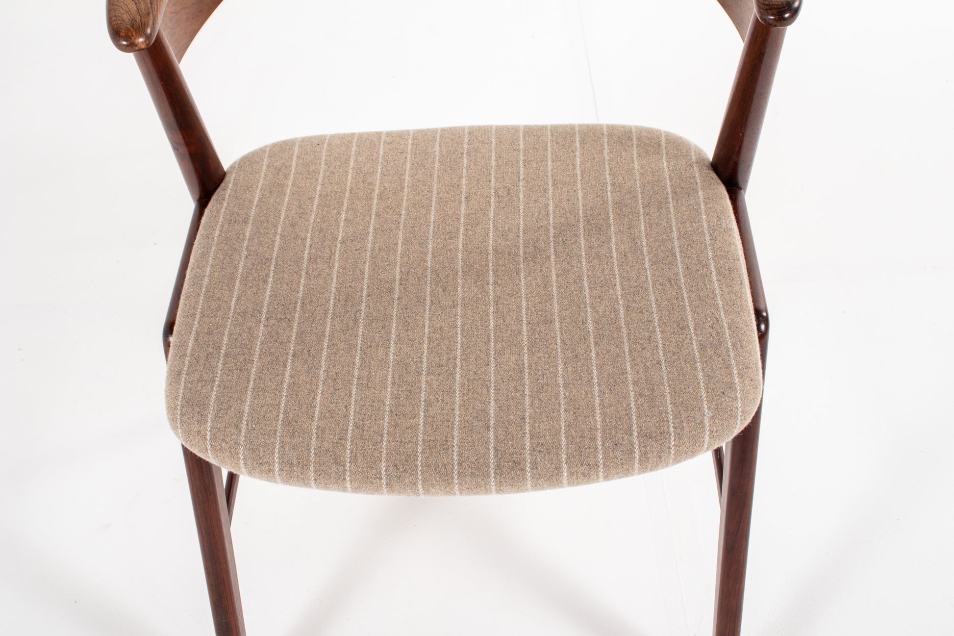 Newly upholstered wool seat with subtle stripe pattern on Danish dining chair