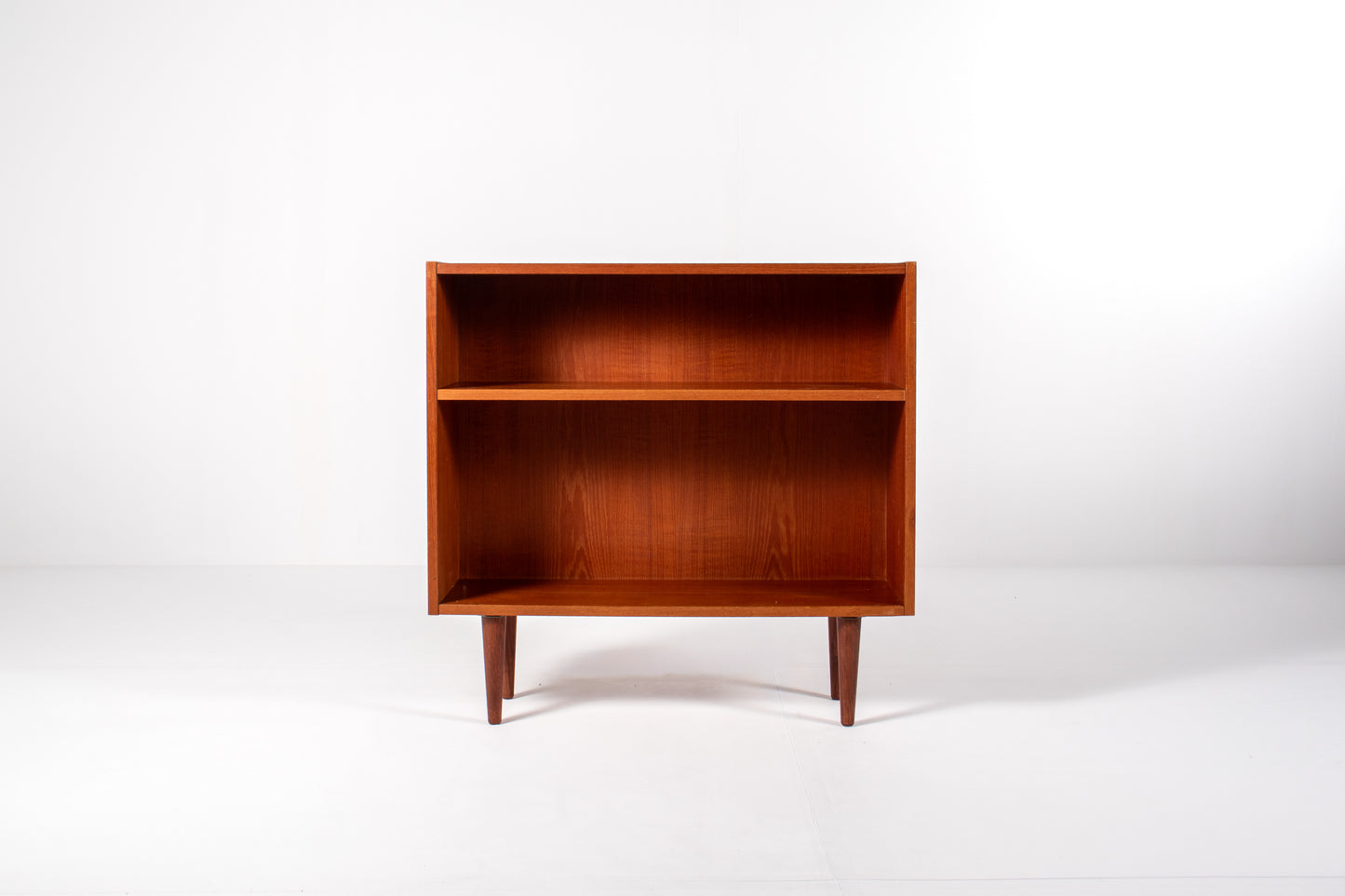 Front view of vintage Danish teak bookcase with minimalist Scandinavian design