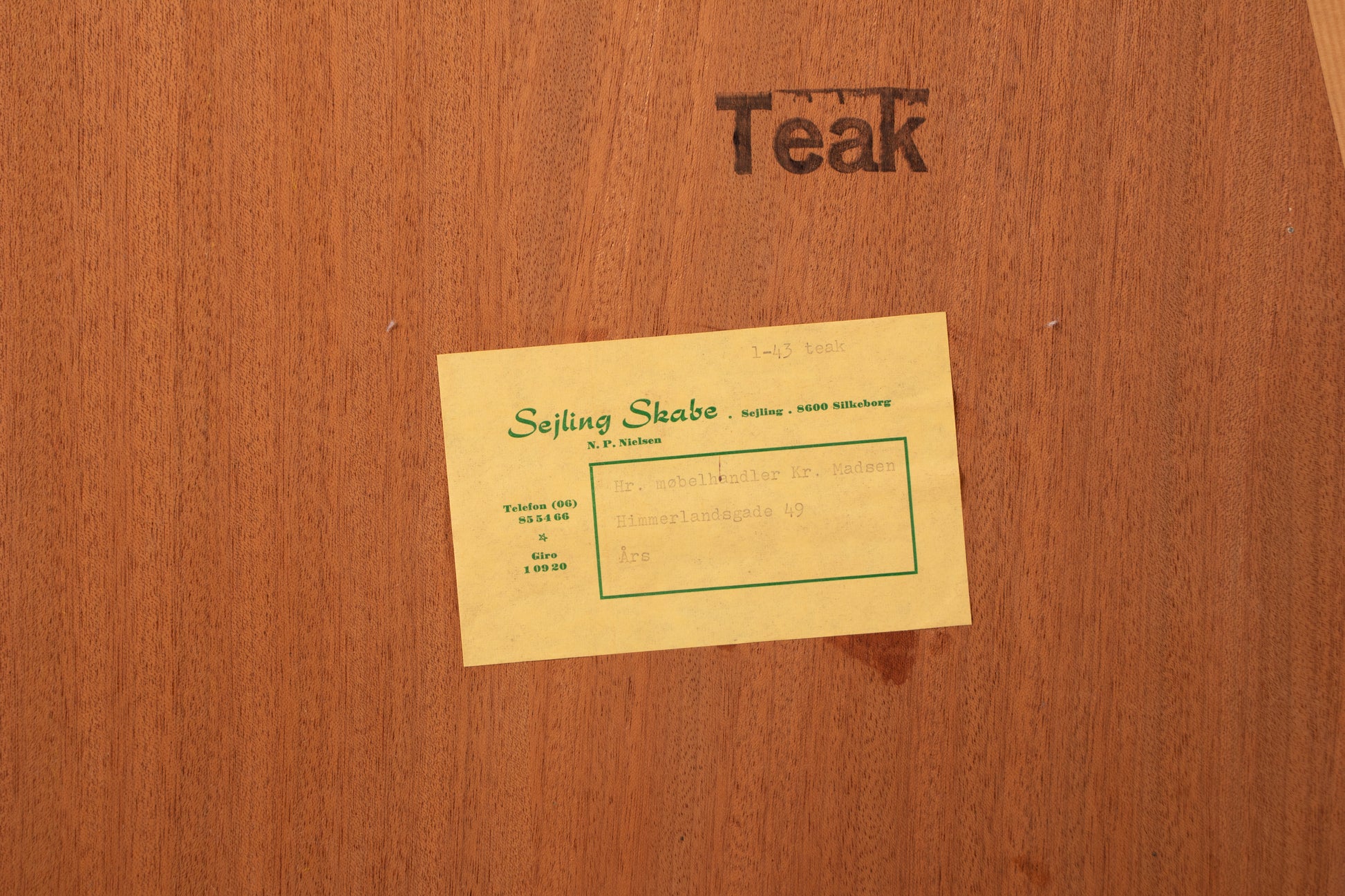 Original Sejling Skabe label and teak stamp on back of Danish bookcase