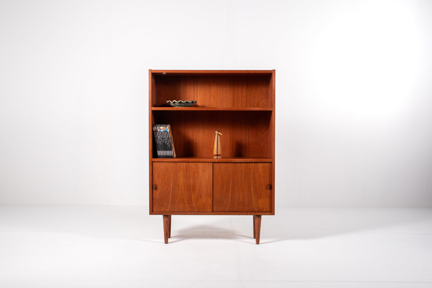 Front view of Danish teak bookcase with open shelves and sliding doors, Sejling Skabe 1960s