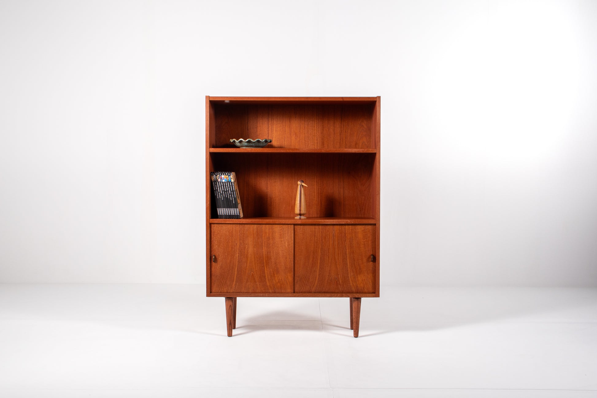Front view of Danish teak bookcase with open shelves and sliding doors, Sejling Skabe 1960s