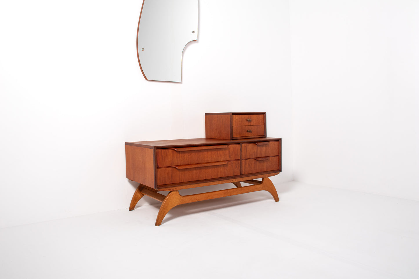 Front view of Danish mid-century teak low chest with drawers