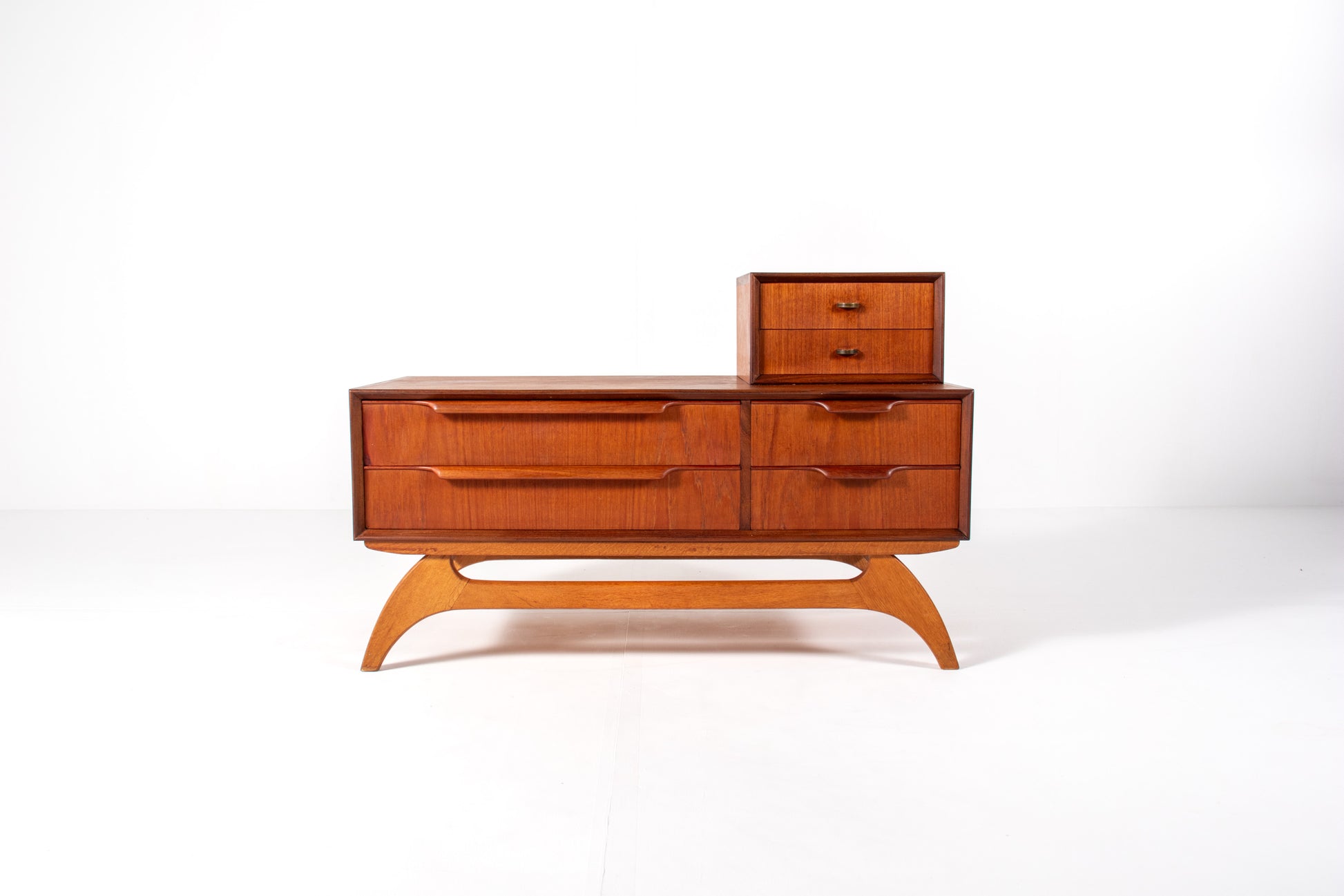 Front view of Danish mid-century teak low chest with drawers
