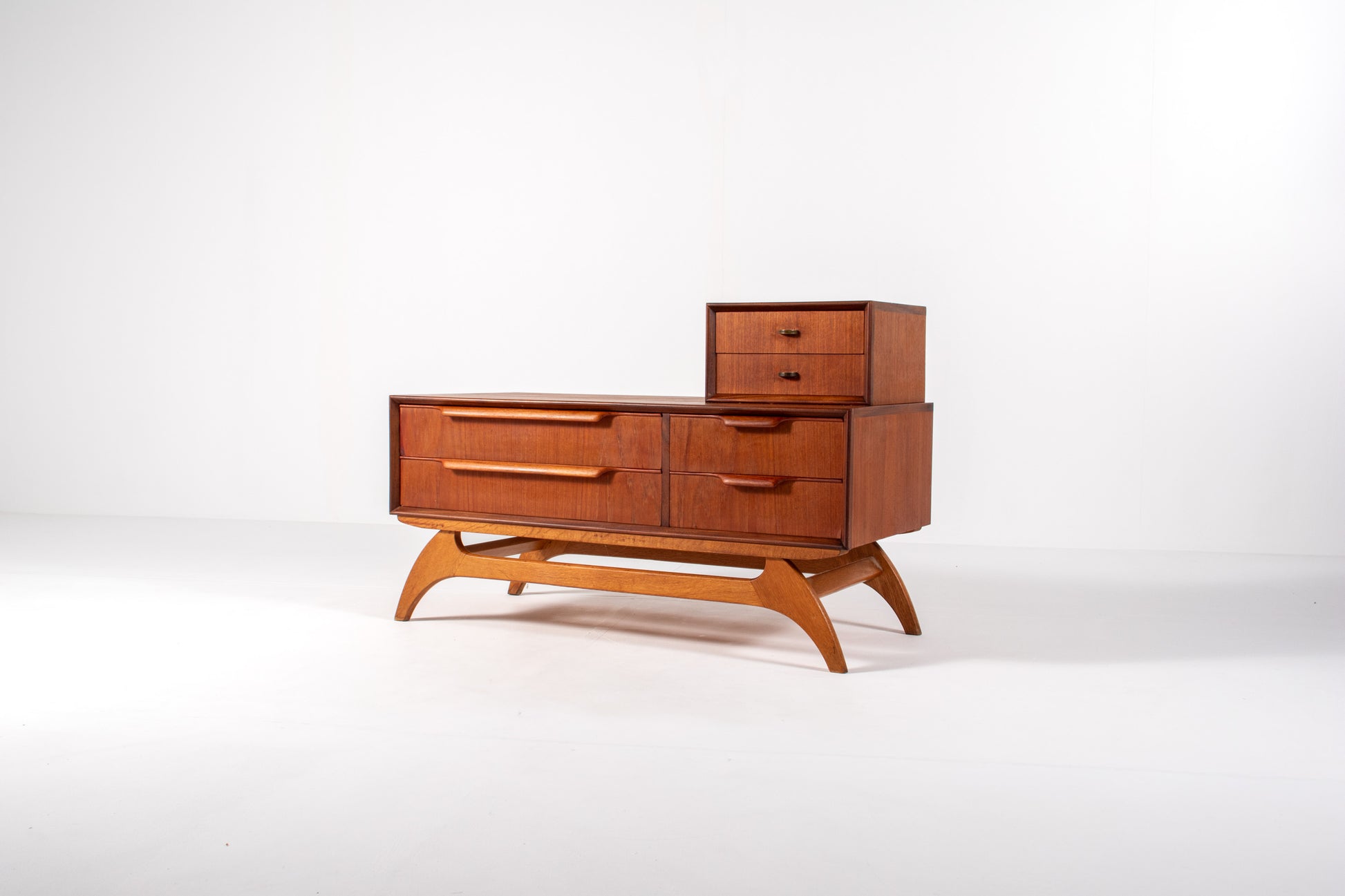 Side view of mid-century Danish teak chest and mirror